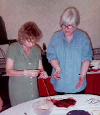 Gloria Lemay teaching placenta examination to Patricia Blomme, R. N. of Calgary, Alberta at the Wise Woman Way of Birth Workshop (2000)